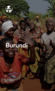 oyful dance and celebration among Burundian women and children, with the Global Care Alliance logo above